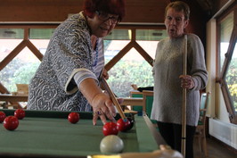 Tenants playing pool at southfields. Two people
