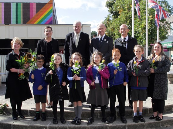 Photo of Sir John Peace with school children