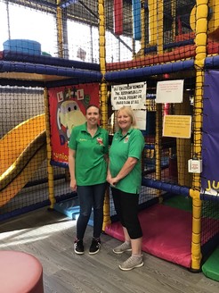 Two women stood in front of play area