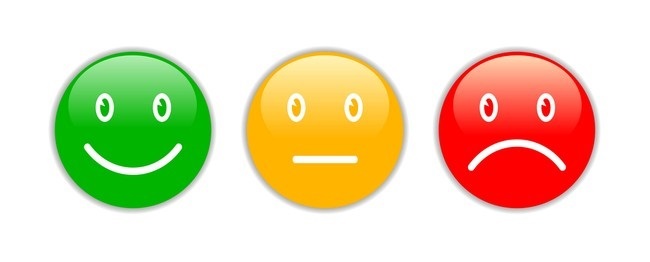 green smile face, orange middle face, and angry sad face