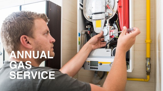Annual gas service - Man servicing boiler