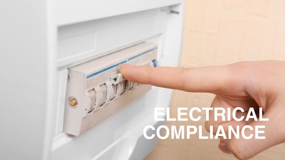 Electrical compliance - man looking at fuse board