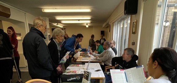 stall holders talking to customers at an independent living open day