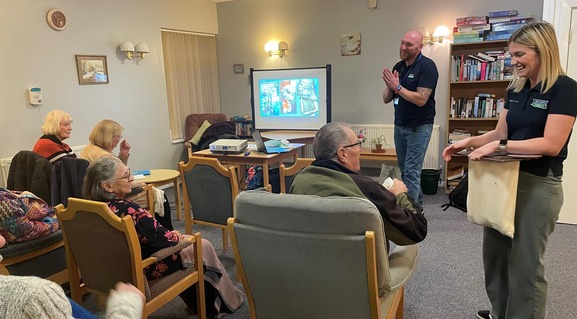 tenants listening to a presentation by housing staff and severn trent in a communal lounge