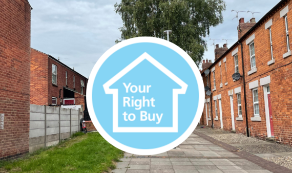 right to buy text infront of a street of housing