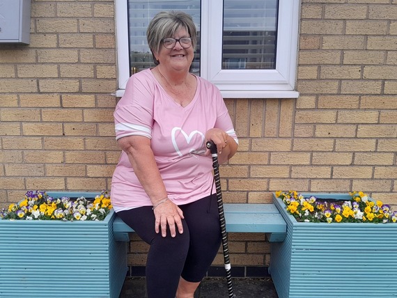 Smiling woman on a bench