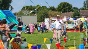 attendees enjoying a performance from the bubble man