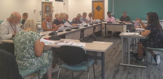 People sat having a meeting