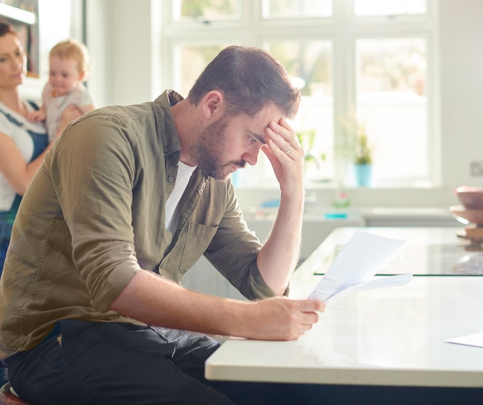 Person sad looking at document