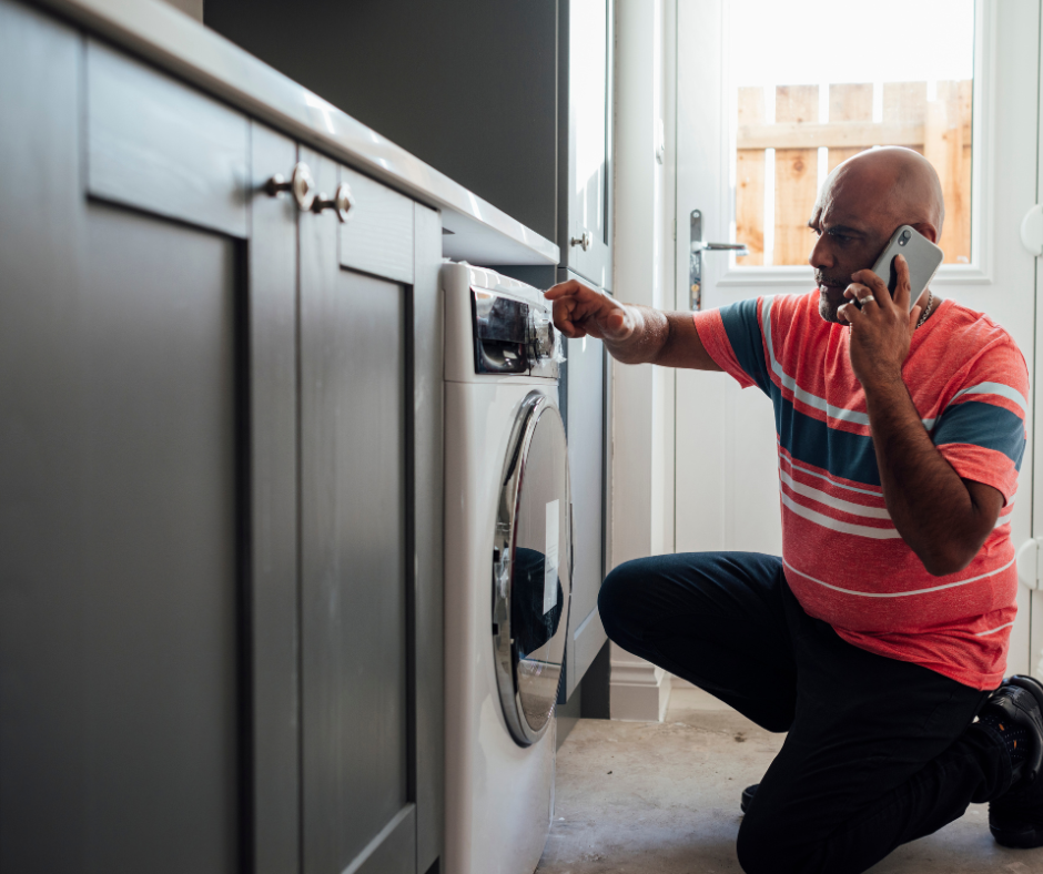 Man phoning washing machine