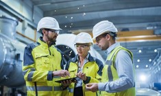 Three engineers in a manufacturing factory