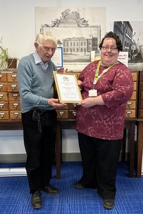 photograph of Mary Burgess of the Cambridgeshire Collection receiving an award