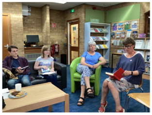 A group of people reading at St Neots Library