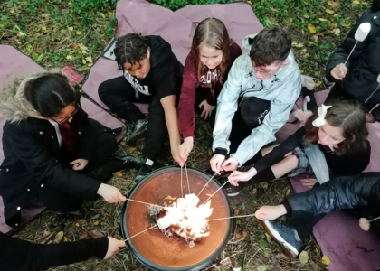 junior foresters around fire pit