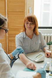 A person getting her blood pressure measured