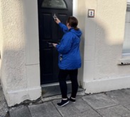 Housing officer knocking door
