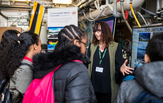 Cefas scientist speaks to shool children on board RV Cefas Endeavour in London for CHOGM
