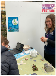a woman on a stand smiling