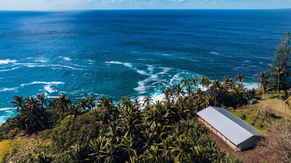 Pitcairn Island science base building on the land with views of the sea