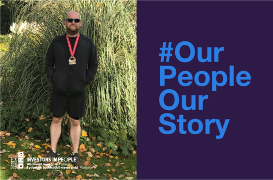 Matthew Pennell, Intelligence Service Manager at Companies House wearing sportswear with a medal around his neck. #OurPeopleOurStory
