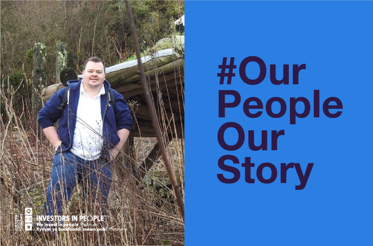 A man standing outdoors with his hand in his pockets. #OurPeopleOurStory