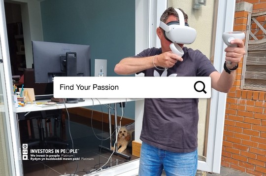 A man using a virtual reality headset with the words 'Find Your Passion'