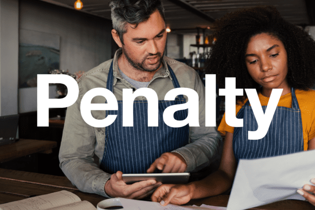 Two people reading a letter with the word 'penalty'. 