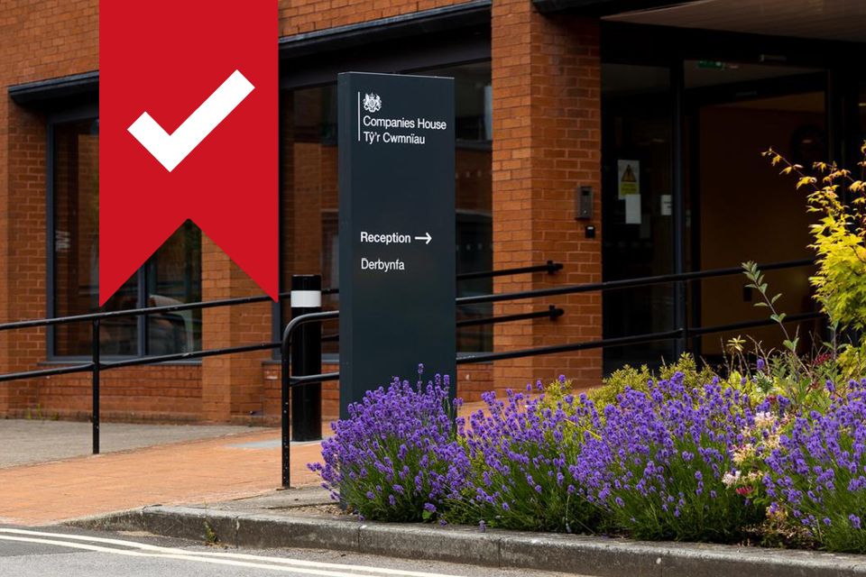 The Companies House office building, with a white tick on a red banner