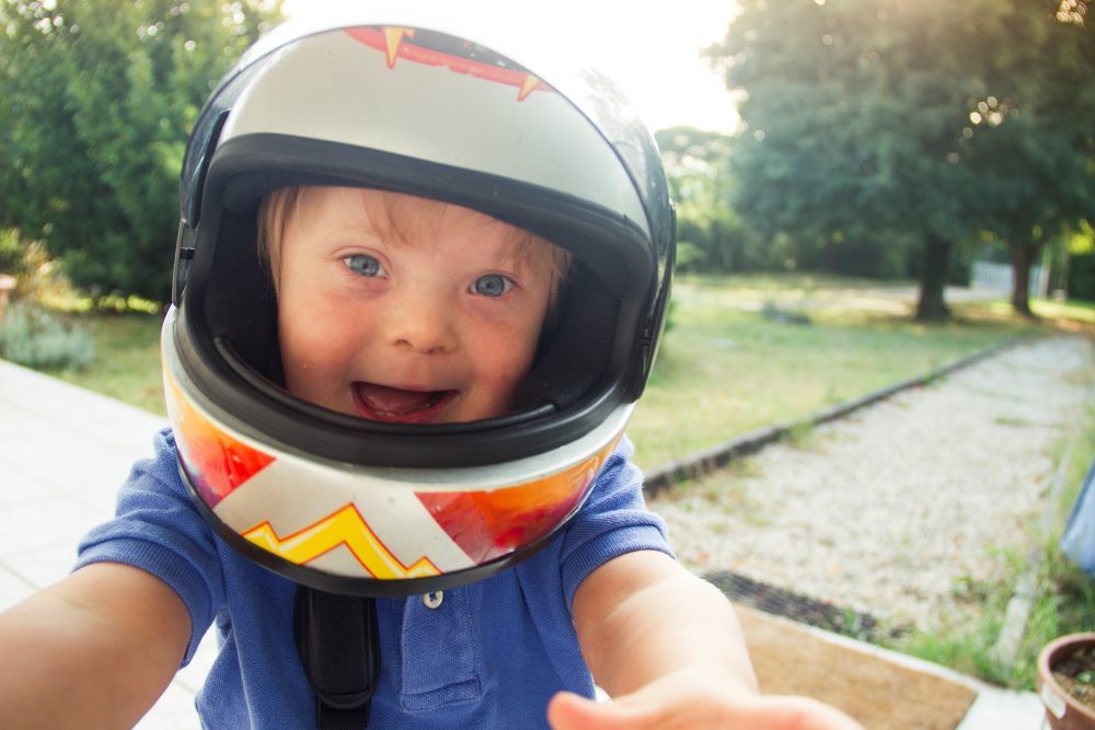 Little boy wearing a crash helmet