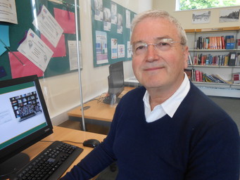 IT Buddy in the library with computer