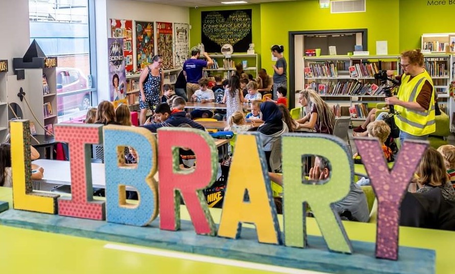 Through the window of a busy library