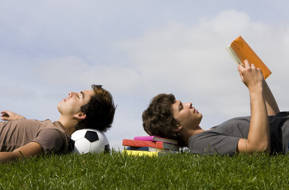lads reading with a football
