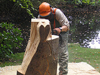 Ranger chainsaw carving at National Trust Hare Hill Gardens