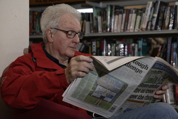 man reading newspaper