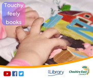 baby looking at a touchy feely book