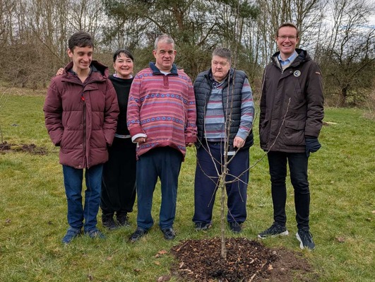 Service users planting trees at Macclesfield Leisure Centre