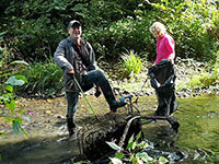 Volunteers helping to clean a river
