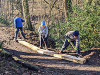 Volunteers working on a path