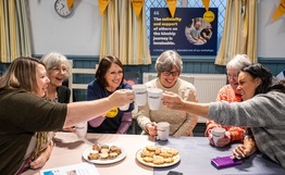 Women share a cup of tea as they celebrate Kinship Care Week
