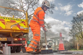 Pothole being repaired