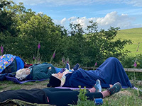 People lying on the grass meditating