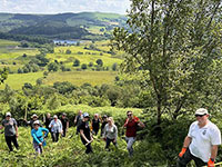Group of volunteers on a heathland slope