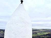 White Nancy with hills in the background
