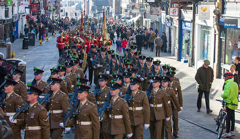 Large military parade of soldiers in Chester city centre