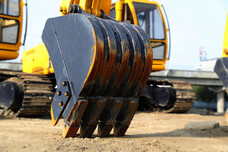 Hydraulic Excavator standing at construction site