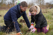 Volunteers planting at a Mersey Forest event
