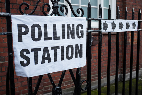 Polling station banner on railings