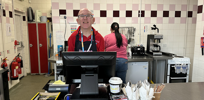 Neil who works at Diverse Dine in EP library on the till