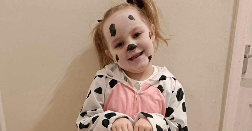 Young girl dressed in dog costume