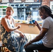 Couple talking in coffee shop